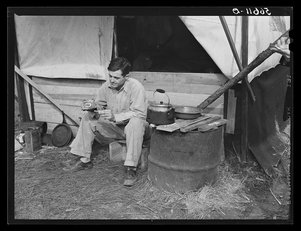 [Untitled photo, possibly related to: D.C. Lovelady in front of tent. He drives a truck at Camp Livingston construction job…