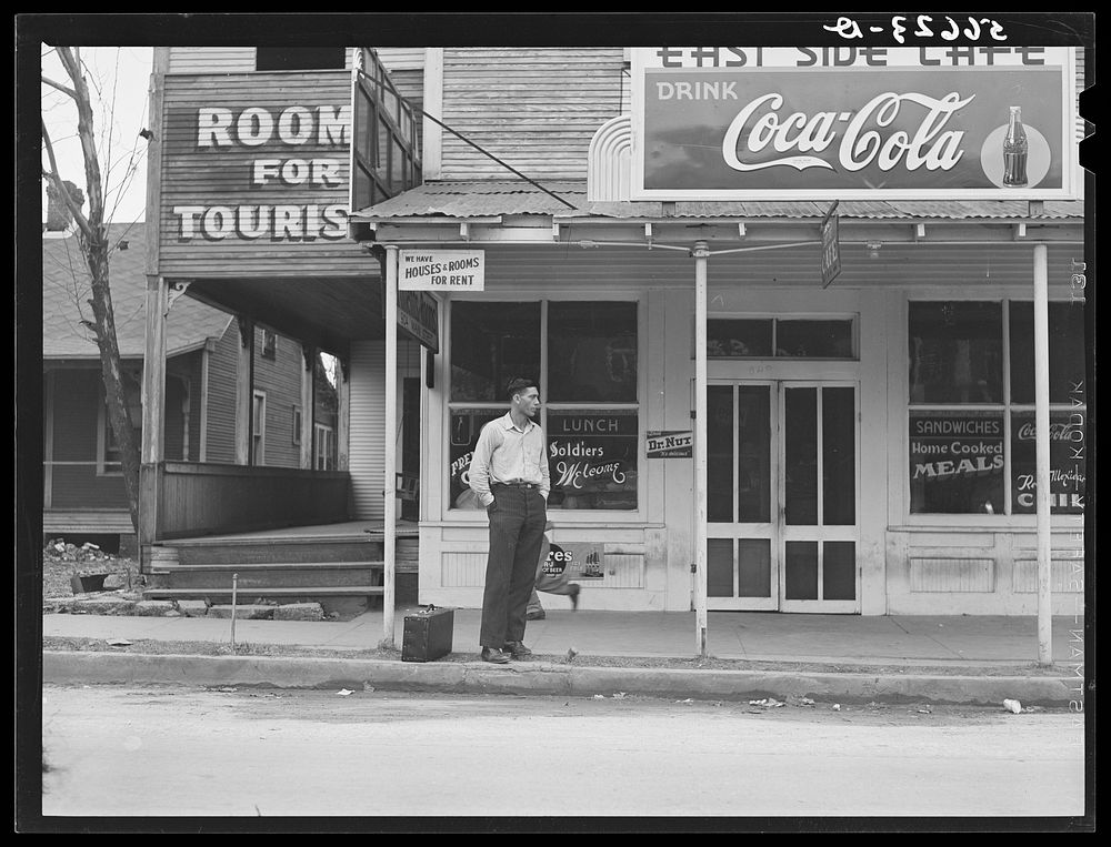 [Untitled photo, possibly related to: East side cafe with rooms for rent, "Soldiers Welcome," on highway to Camp Livingston…