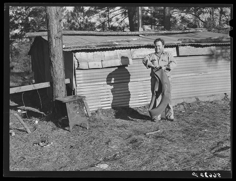 [Untitled photo, possibly related to: Construction workers' shack on government property off new highway to flying field…