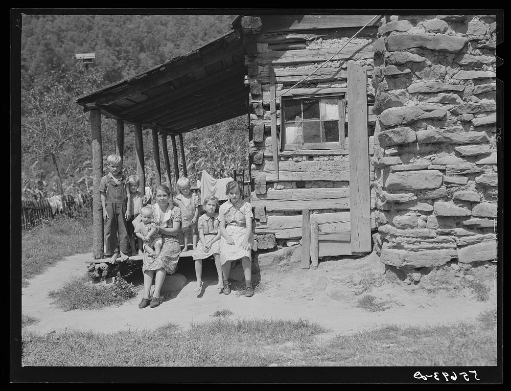 Mountain family on porch of their home made of hand hewn logs up South Fork of Kentucky River, Breathitt County, Kentucky.…