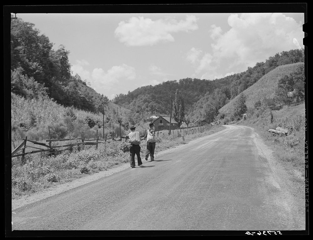 Mountaineers carrying home groceries and supplies from general store near Hyden, Kentucky. Sourced from the Library of…