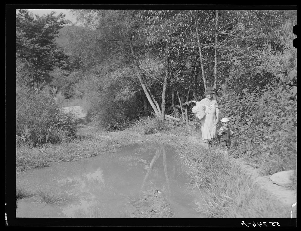 Mountain woman bringing home supplies from the store on Burton's Fork off Middle Fork of the Kentucky River. Breathitt…