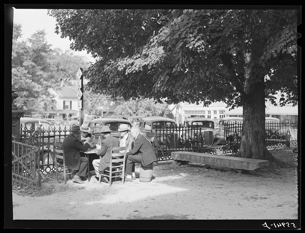 [Untitled photo, possibly related to: Men playing cards in yard in front of court house in Yanceyville, Caswell County…