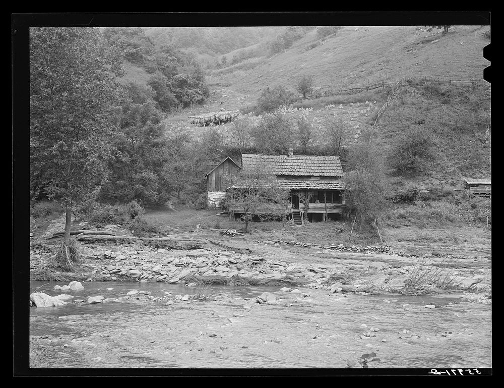 Farm house along creek bed in recently flooded area northwest of Asheville, North Carolina. Sourced from the Library of…