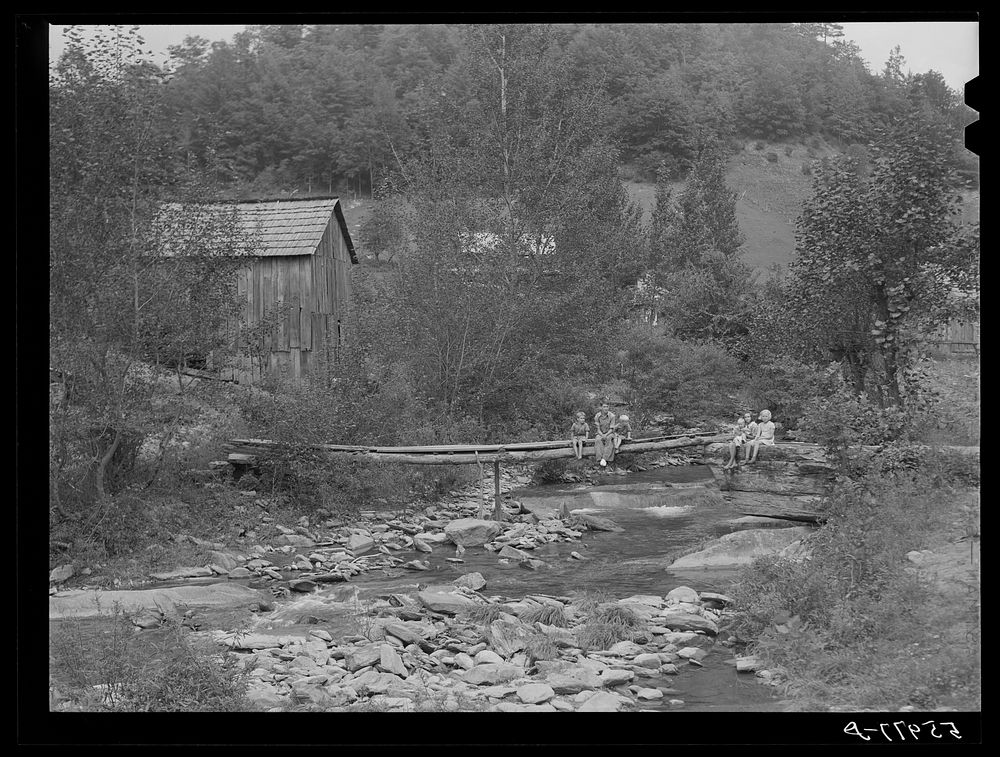 Farmhouses along creek bed in recently flooded area northwest of Asheville, North Carolina. Sourced from the Library of…