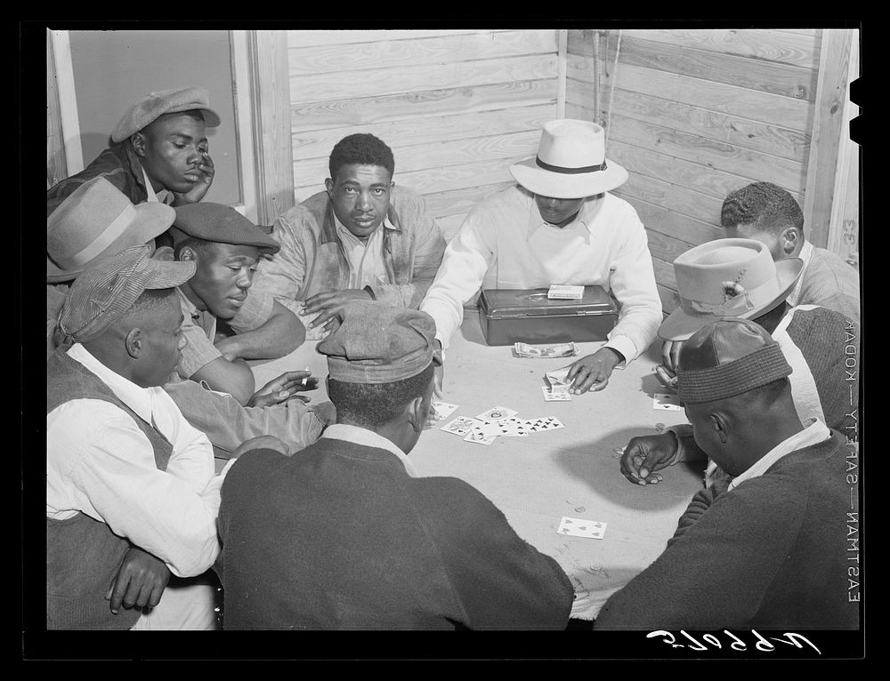 Migratory laborers and vegetable pickers playing "skin" game in back of juke joint and bar in the Belle Glade area of south…
