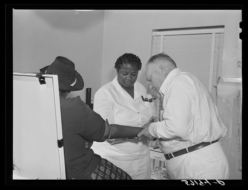 Health clinic for agricultural workers at Okeechobee migratory labor camp. Belle Glade, Florida. Sourced from the Library of…