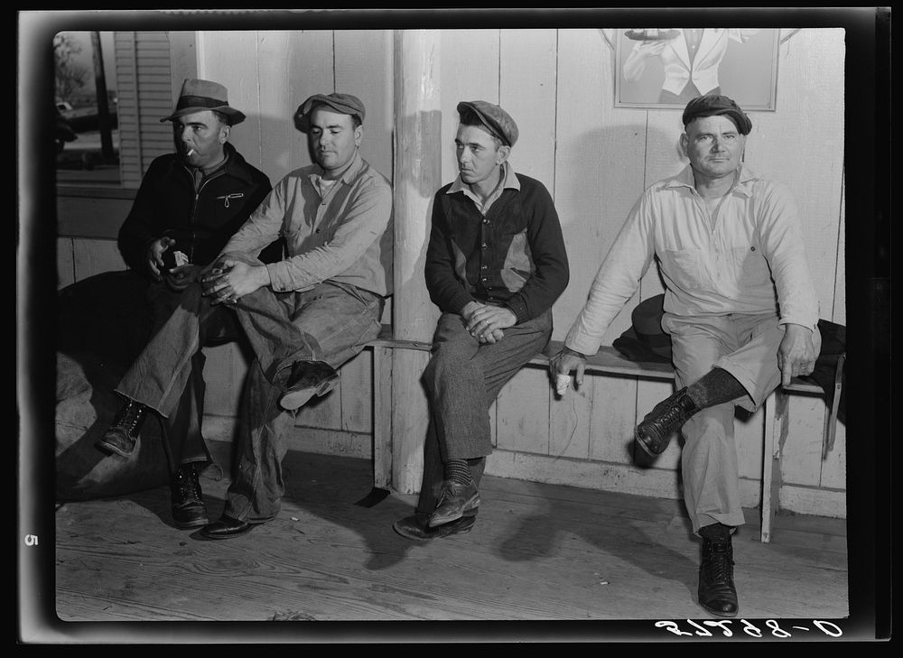 Spanish muskrat trappers waiting in dance hall during fur auction sale. Delacroix Island, Louisiana. Sourced from the…