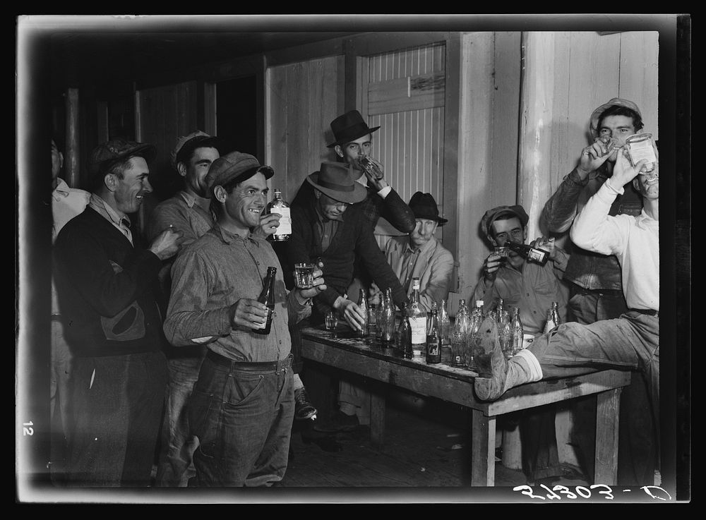 Spanish muskrat trappers have a round of drinks after each lot is sold at the fur auction held in a dance hall on Delacroix…