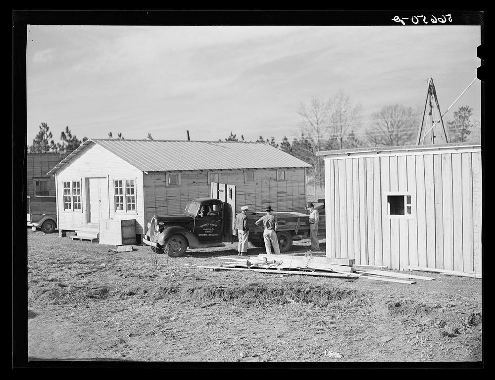 [Untitled photo, possibly related to: Cars of construction workers at Camp Claiborne, Alexandria, Louisiana. New buildings…