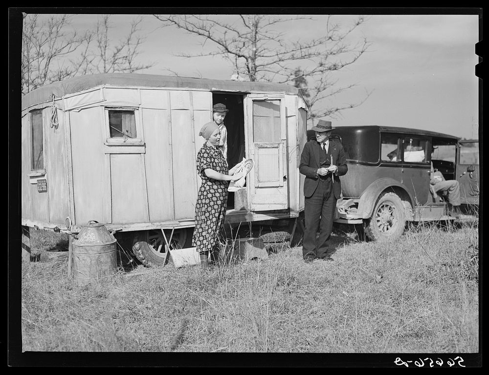 Reverend Bullard, preacher, and family with trailer home. Alexandria, Louisiana. Sourced from the Library of Congress.