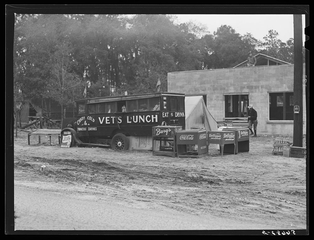 [Untitled photo, possibly related to: Highway to Camp Blanding. "Vets' Lunch" in foreground, new laundry being built, and…