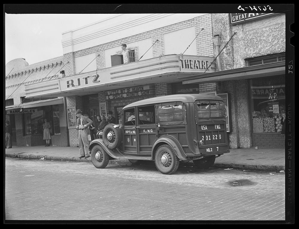 Army transport in front of remodeled theatre in Starke, Florida. Sourced from the Library of Congress.