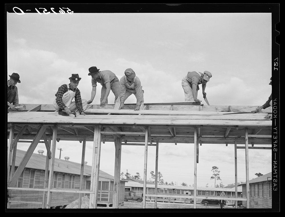 Carpenters constructing new Army barracks at Camp Blanding. Starke, Florida. Sourced from the Library of Congress.