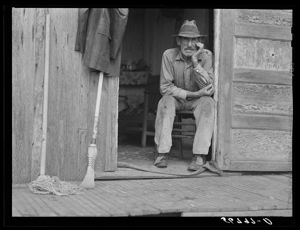 [Untitled photo, possibly related to: Spanish muskrat trapper in doorway of his marsh camp. Delacroix Island, Saint Bernard…