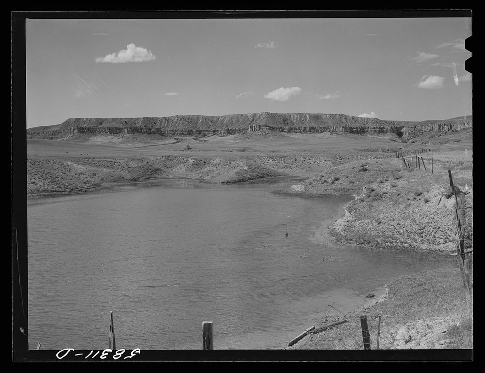Reservoir for cattle and grazing land on Indian reservation near Crow Agency, Montana. Sourced from the Library of Congress.
