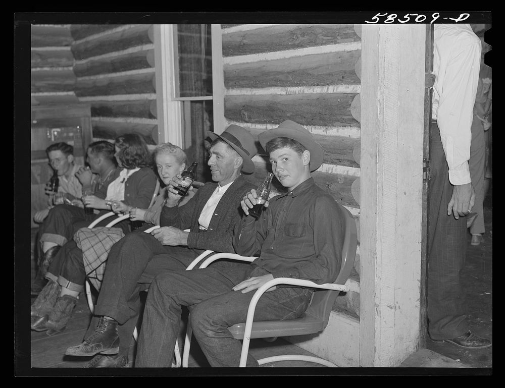 People resting between dances. Saturday night in Birney, Montana. Sourced from the Library of Congress.