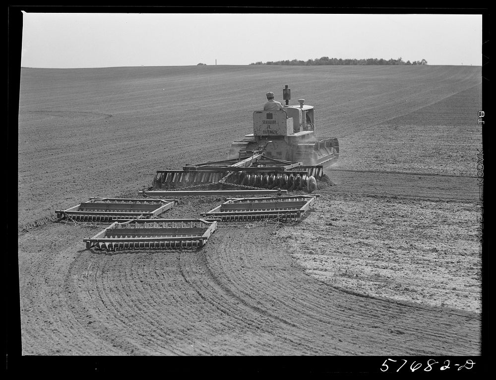 Harrowing fields with diesel tractors at Seabrook Farms. Bridgeton, New Jersey. Sourced from the Library of Congress.