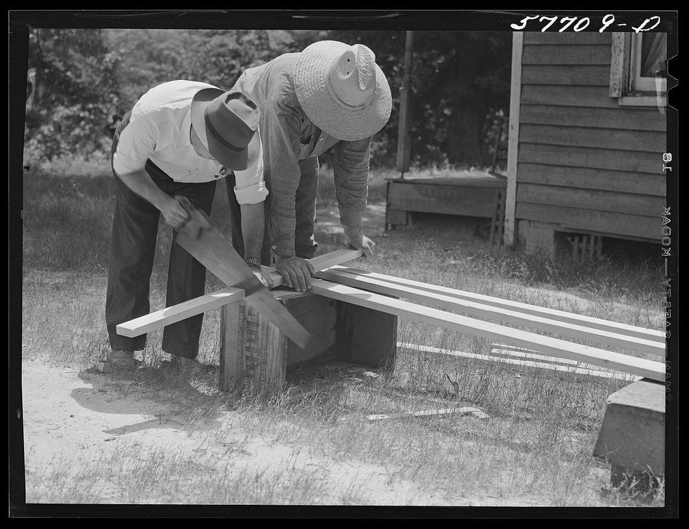 [Untitled photo, possibly related to: Cutting screen door stock to measurement. Screening demonstration. Charles County, La…