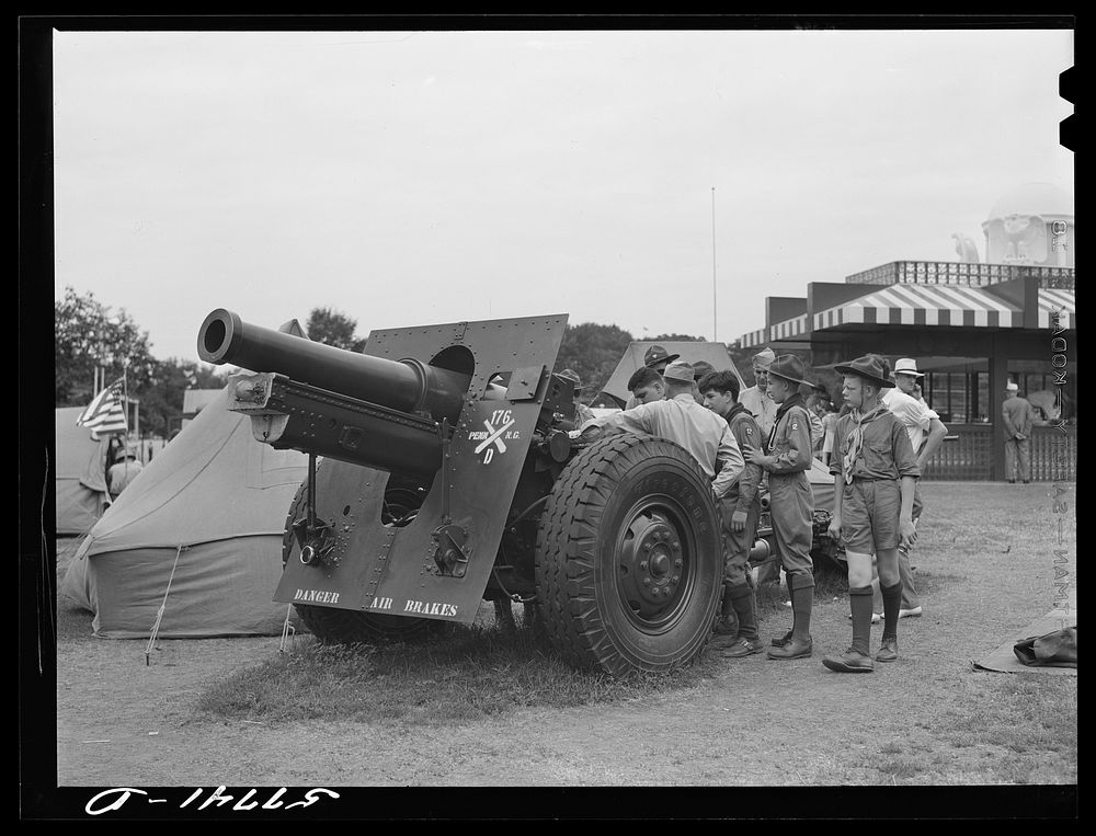 Boy scouts inspecting and learning about Army equipment in Commerce Square, Washington, D.C.. Sourced from the Library of…