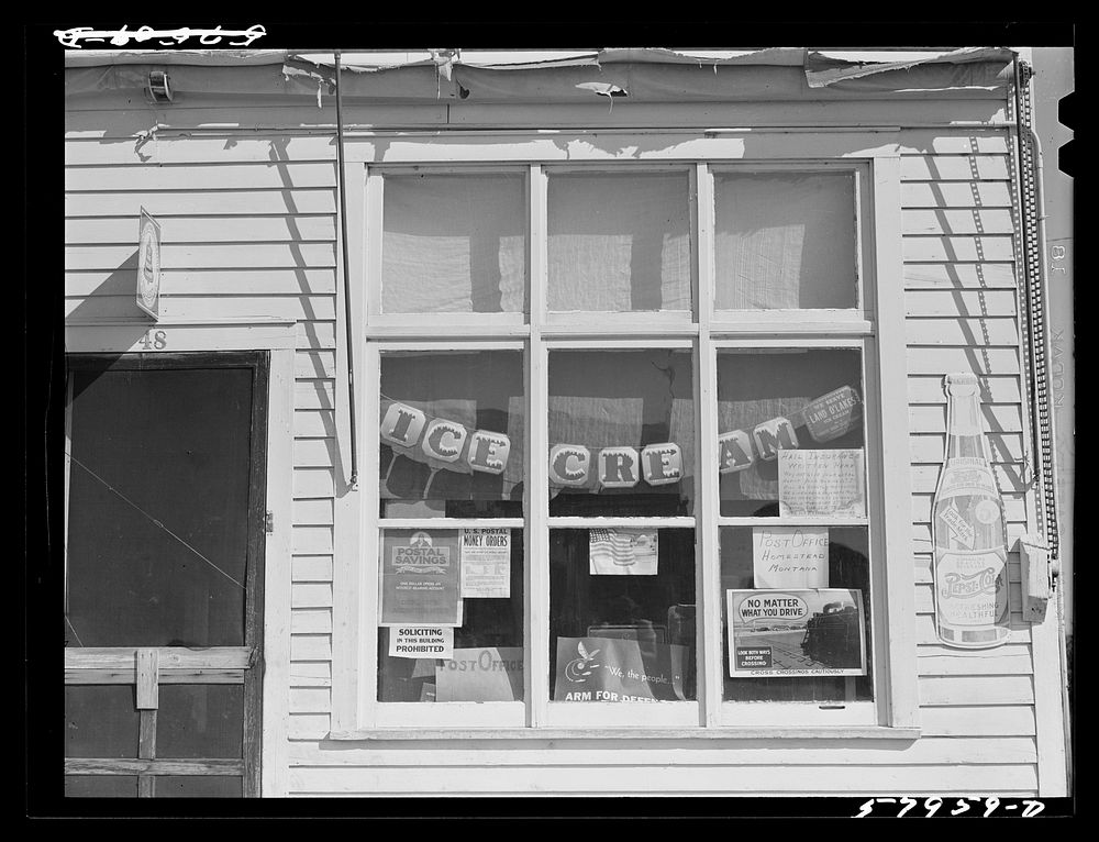 Window of post office and store. Homestead, Montana. Sourced from the Library of Congress.
