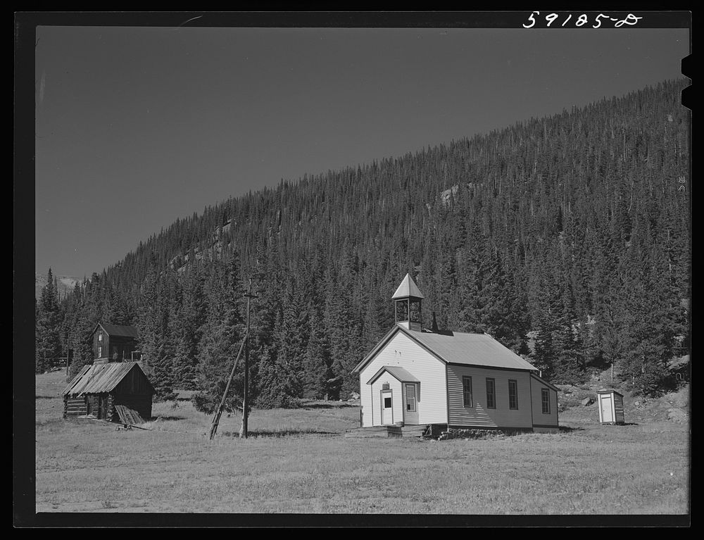 Church and houses in Montezuma, Colorado, ghost town now coming to life because of defense mining boom. Sourced from the…