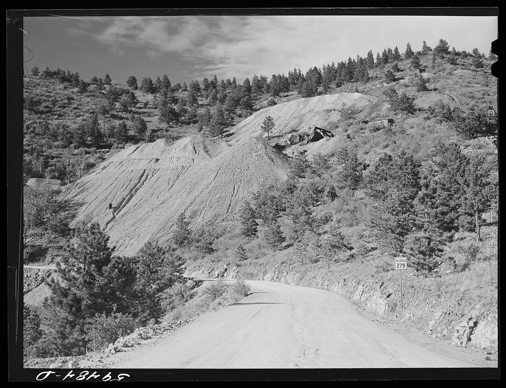 Road from Idaho Springs to Central City, Colorado, showing slag pile and tipple of old mine. Sourced from the Library of…