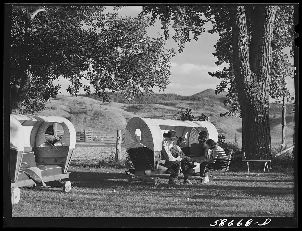 [Untitled photo, possibly related to: Quarter Circle U, Brewster-Arnold Ranch. Birney, Montana. Dudes in a covered wagon…