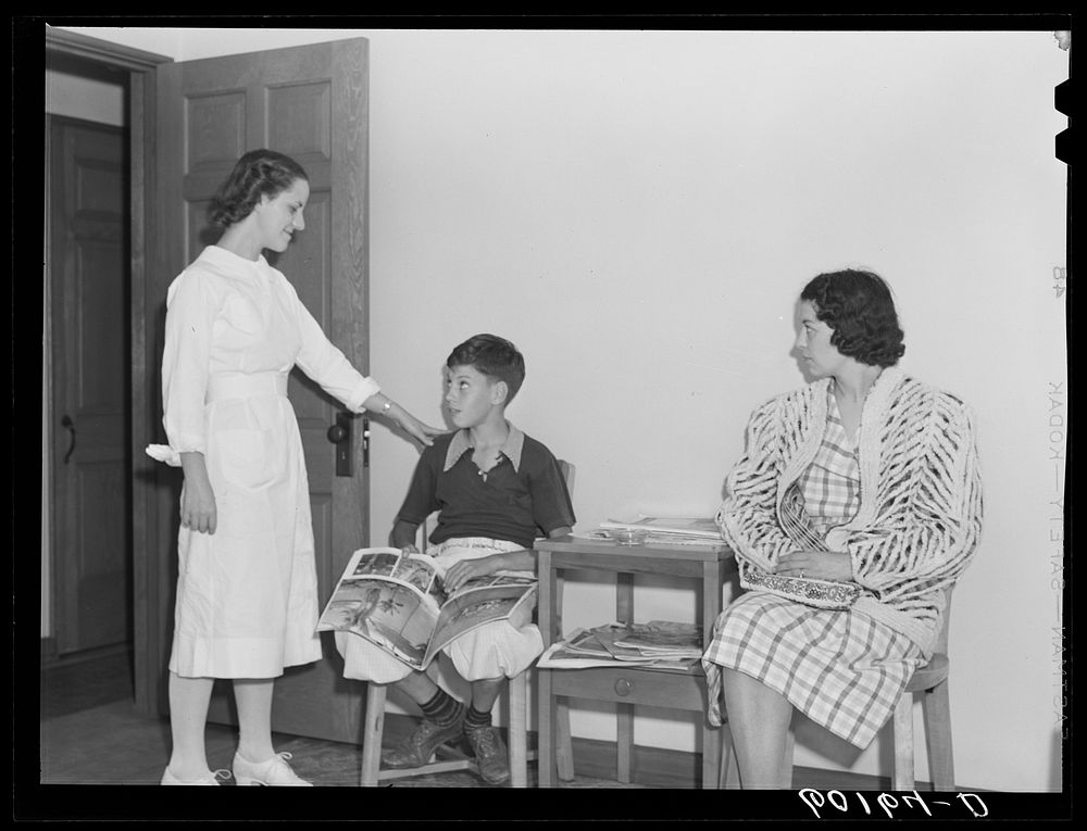 [Untitled photo, possibly related to: Doctor examining boy's throat. Greendale, Wisconsin. This is the Greendale branch of…