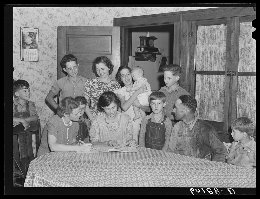 Home supervisor (FSA (Farm Security Administration)) visiting family of rehabilitation client. Grant County, Wisconsin.…
