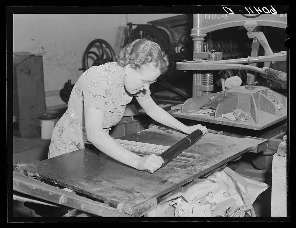 Editor of the Valley News inking column of type. Browns Valley, Minnesota. Sourced from the Library of Congress.