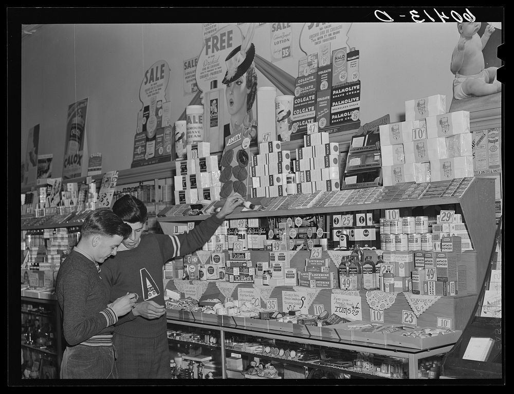 High school boys looking over shaving equipment in drug store. Graceville, Minnesota. Sourced from the Library of Congress.