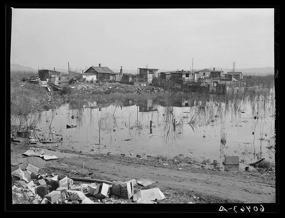 Shacktown adjoining city dump along riverfront. Dubuque, Iowa. Sourced from the Library of Congress.