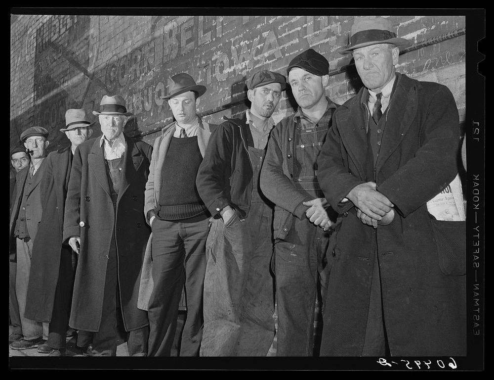Men waiting in line outside the city mission--the first twenty-five will be fed. Dubuque, Iowa. Sourced from the Library of…