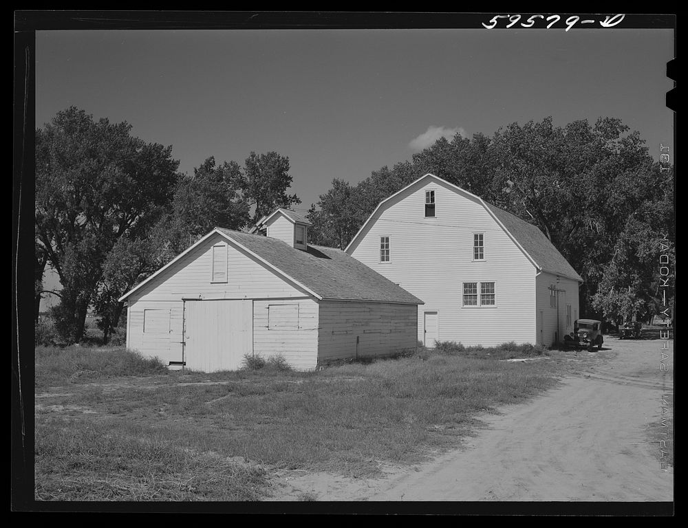 Barn and equipment shed at Two Rivers Non-Stock Cooperative, a FSA (Farm Security Administration) co-op. Waterloo, Nebraska.…