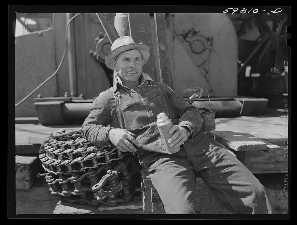 Oil worker eating lunch, works for Continental oil company. Moundridge area near McPherson, Kansas. Sourced from the Library…