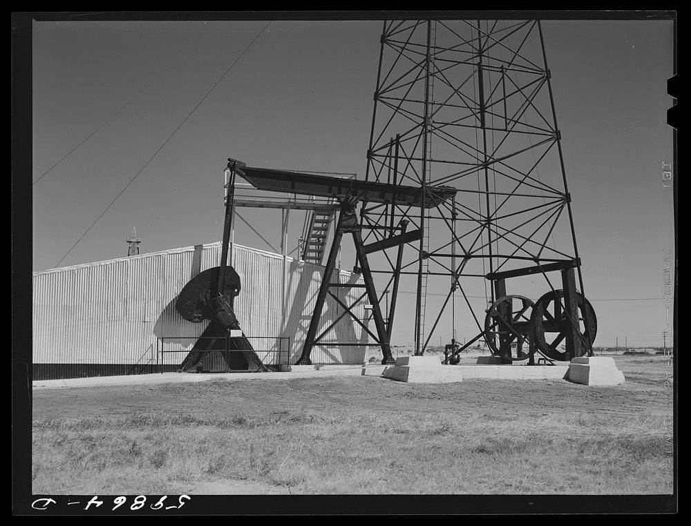 Oil well derricks and pumps in Moundridge area near McPherson, Kansas. Sourced from the Library of Congress.
