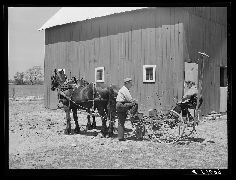 FSA (Farm Security Administration) tenant purchase borrower on corn planter, talking with county supervisor. Crawford…