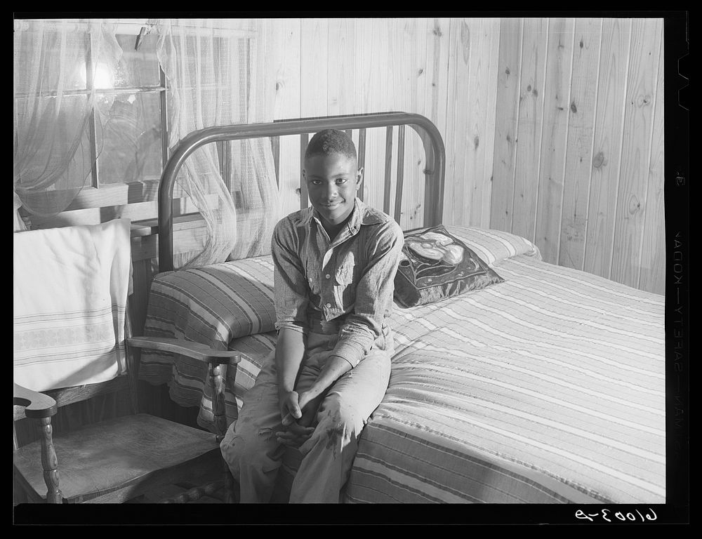 Boy at Southeast Missouri project in his bedroom. Sourced from the Library of Congress.