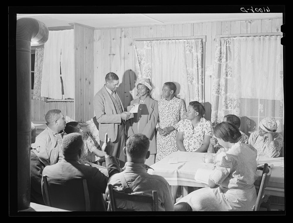 Meeting of farmers and wives to discuss farm problems. Southeast Missouri Farms. Sourced from the Library of Congress.