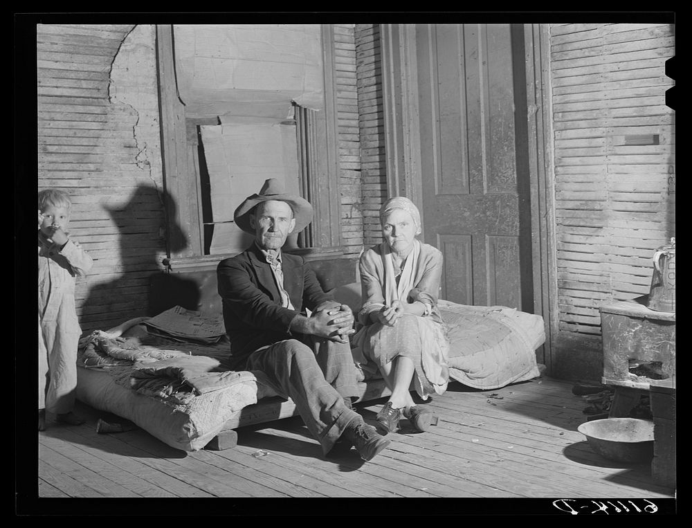 Migrant couple living in one room of abandoned house on property of fruit grower. Berrien County, Michigan. Sourced from the…