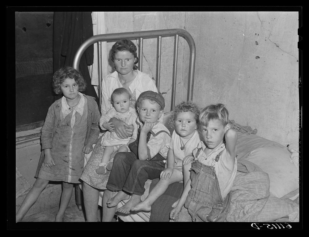 Mother, father, and five children sleep in this one room of an abandoned house on property of fruit grower. Berrien County…