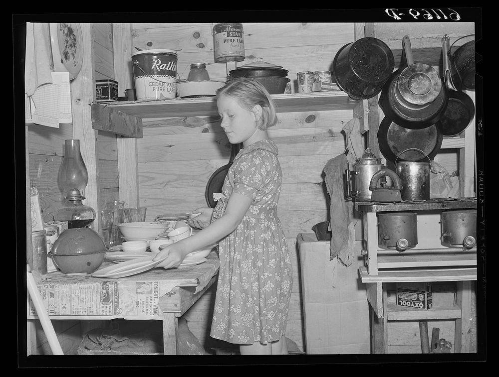 Daughter of migrant fruit worker in cabin (one room) which rents for one dollar and seventy-five cents a week. Berrien…