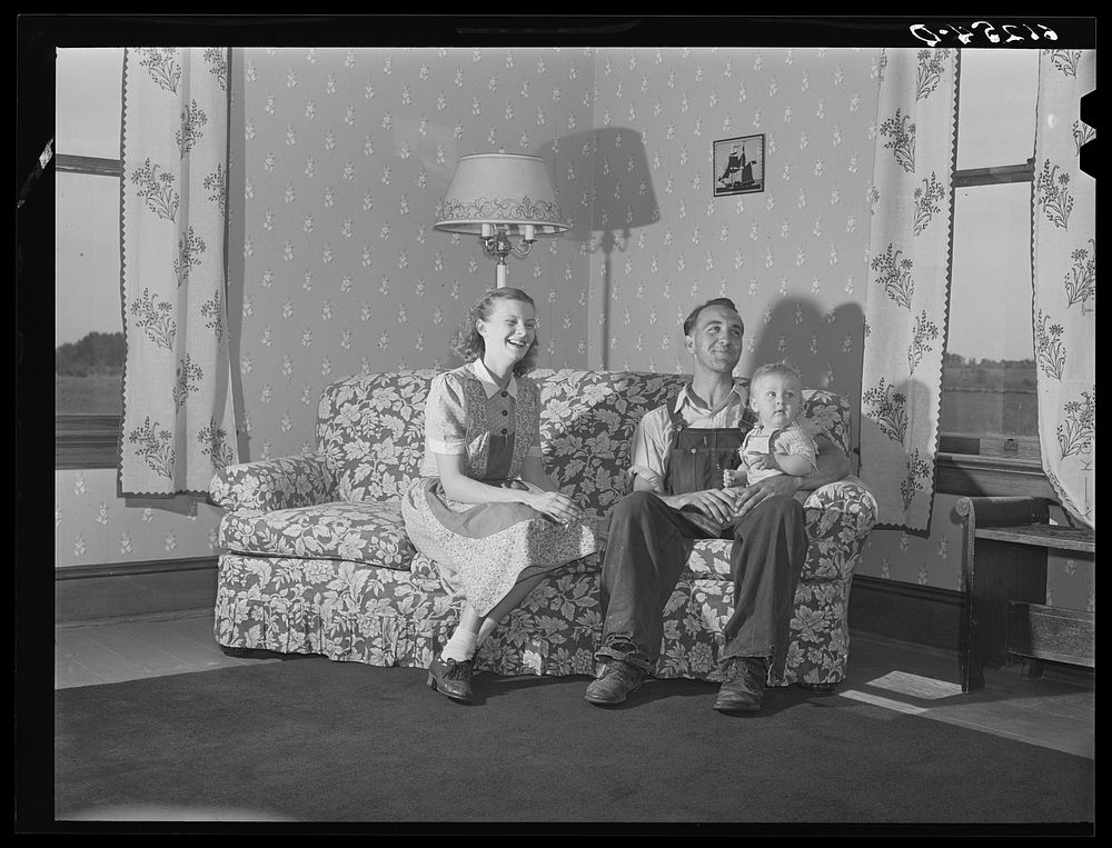 FSA (Farm Security Administration) rehabilitation borrower and family. The wife made the drapes, the chair covers, and…