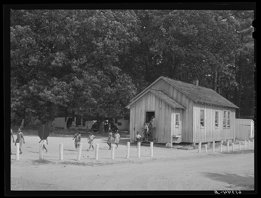 Children coming out of school at noon. School near Scotland, Maryland. Saint Mary's County, Maryland. Sourced from the…