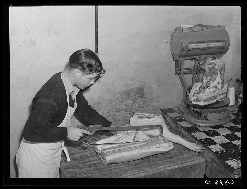 Cutting meats before freezing. Co-op cold storage lockers. Casselton, North Dakota. Sourced from the Library of Congress.