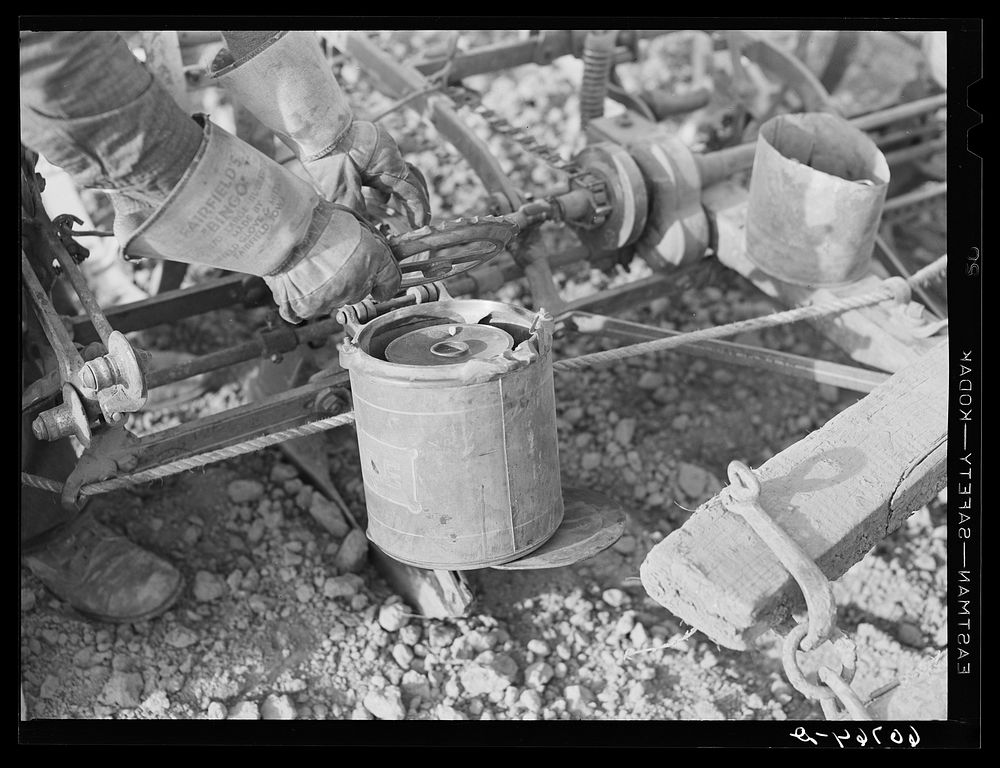 Adjusting plate on corn planter. Monona County, Iowa. Sourced from the Library of Congress.