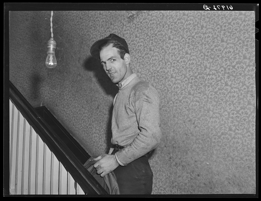 Powder plant employee going upstairs. Mrs. Pritchard's boardinghouse. Radford, Virginia. Sourced from the Library of…