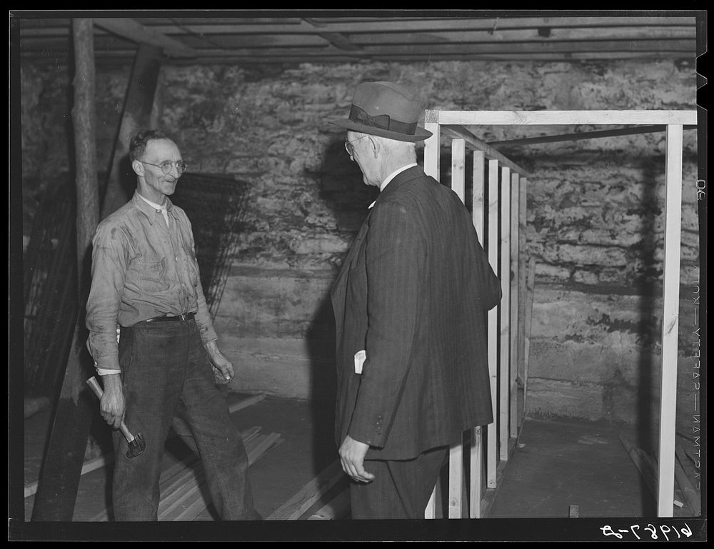 [Untitled photo, possibly related to: Workmen building a room in the basement of Mr. Tilly's furniture store; secondhand…