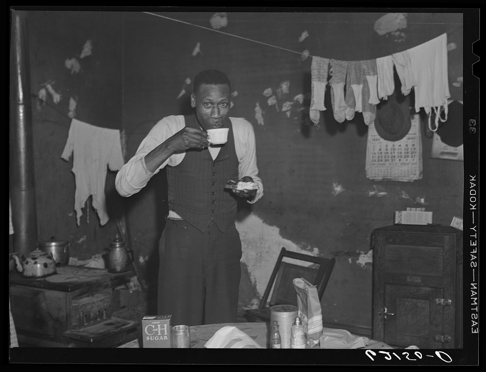 Steelworker eating lunch in his apartment. Aliquippa, Pennsylvania. Sourced from the Library of Congress.